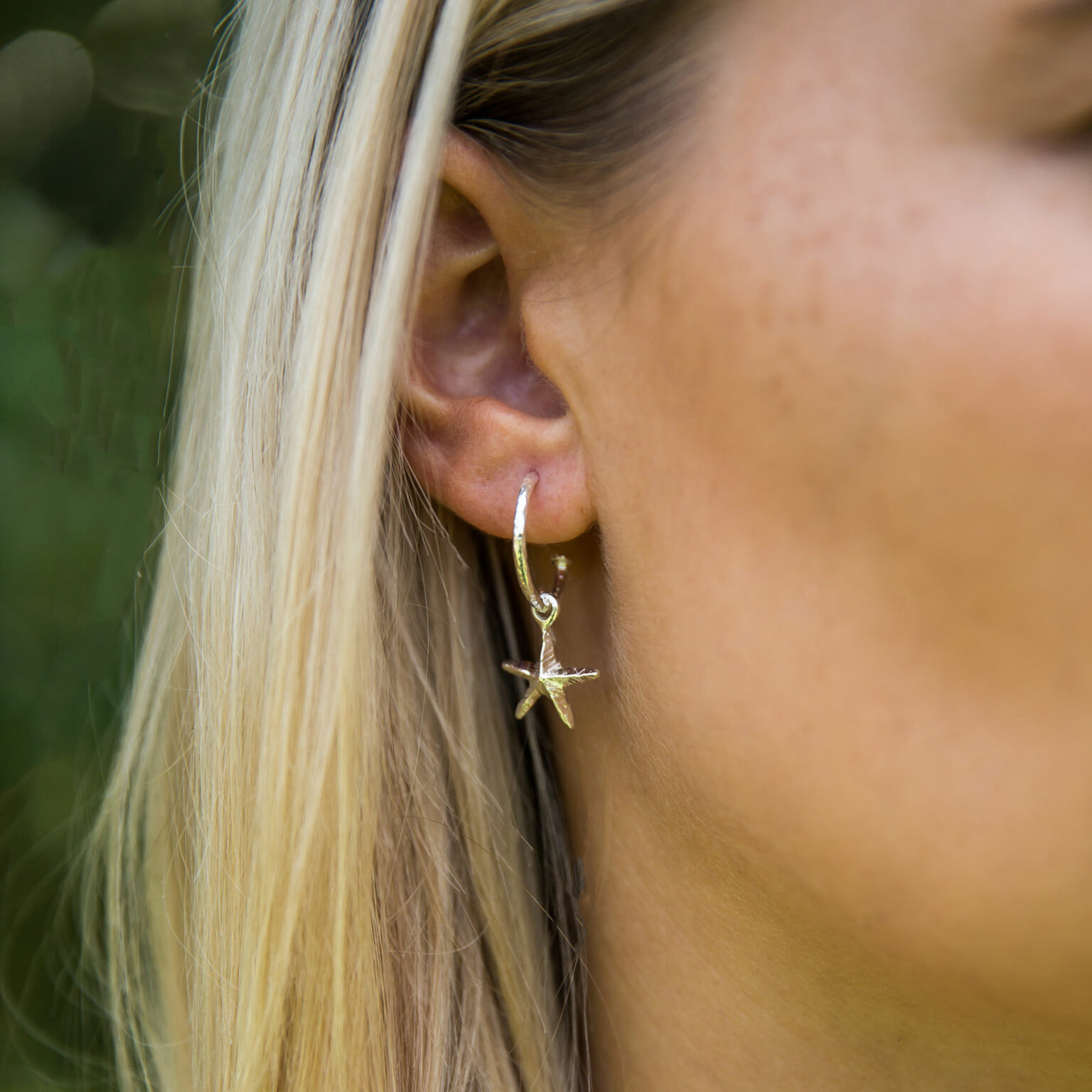 Silver starfish on hoop earrings