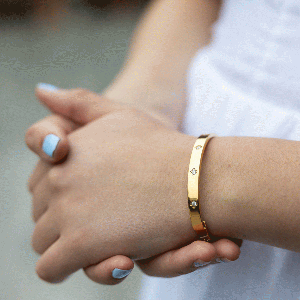 Gold clover bangle with a touch of sparkle