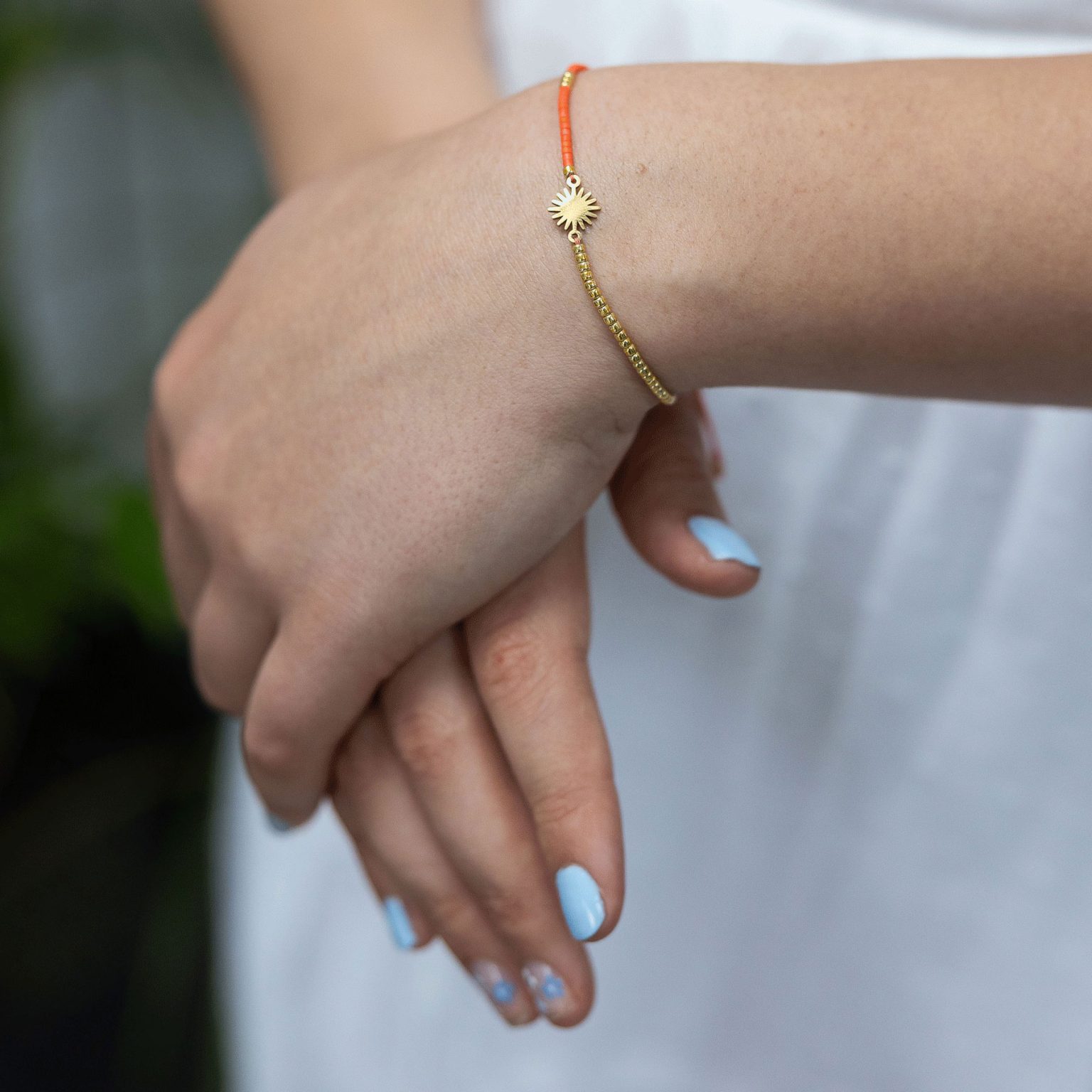 Orange bead and sun friendship bracelet