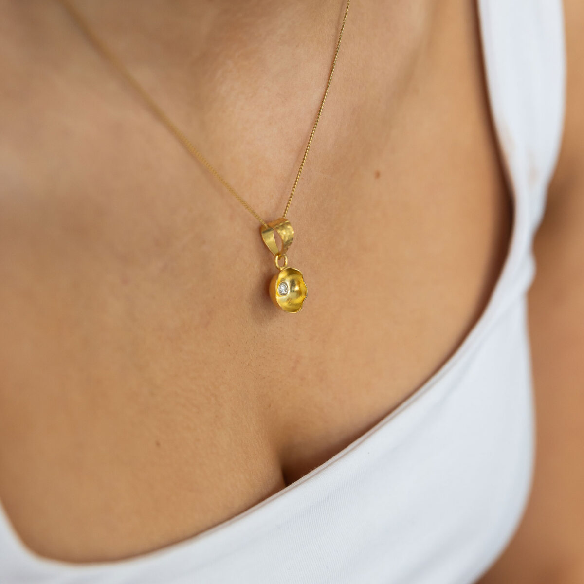 Brushed gold abstract flower necklace